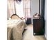 Bedroom with natural light, stylish dresser, and comfortable bed, perfect for relaxation and restful sleep at 2403 Brianna Dr, Hampton, GA 30228
