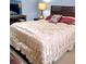 Inviting bedroom featuring a comfortable bed, soft lighting, and coordinated decor for relaxation and peaceful sleep at 2403 Brianna Dr, Hampton, GA 30228