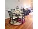 Cozy dining area featuring a glass-top table with four chairs and a rug that ties the room together at 2403 Brianna Dr, Hampton, GA 30228