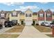 Charming townhouses each with unique exteriors and individual garages, set in a well-maintained community at 2403 Brianna Dr, Hampton, GA 30228