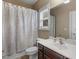 Bathroom featuring a shower-tub combination, neutral paint, and a cherry vanity at 1258 Mcallistar Dr, Locust Grove, GA 30248