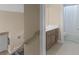Upstairs hallway leading to a bathroom with a combined tub and shower at 1258 Mcallistar Dr, Locust Grove, GA 30248