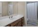 Bathroom with a shower and tub combination, a tile floor and a sink with a wood vanity at 1258 Mcallistar Dr, Locust Grove, GA 30248