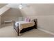 Attic bedroom with dormer ceiling, carpet and neutral paint at 1258 Mcallistar Dr, Locust Grove, GA 30248