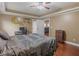 Bedroom with hardwood floors, ceiling fan, closet and a desk at 1258 Mcallistar Dr, Locust Grove, GA 30248