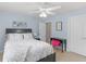 Bedroom featuring light blue walls, carpeted floor, and a closet with door and adjacent bathroom door at 1258 Mcallistar Dr, Locust Grove, GA 30248