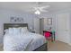 Bedroom featuring a queen bed, desk, and white walls at 1258 Mcallistar Dr, Locust Grove, GA 30248