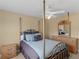 Bright bedroom featuring a four-poster bed, a dresser, and two nightstands at 1258 Mcallistar Dr, Locust Grove, GA 30248