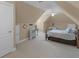 Spacious bedroom with neutral carpeting and a pitched ceiling at 1258 Mcallistar Dr, Locust Grove, GA 30248