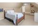 Bedroom with neutral carpet, pitched ceiling, and sports poster on the wall at 1258 Mcallistar Dr, Locust Grove, GA 30248