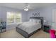 Bedroom featuring a queen bed, white walls, and a window with natural light at 1258 Mcallistar Dr, Locust Grove, GA 30248