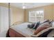 Bedroom with a gold metal canopy bed, a ceiling fan, and a window with blinds at 1258 Mcallistar Dr, Locust Grove, GA 30248