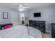 Bedroom featuring light blue walls, carpeted floor, and a closet with door and adjacent bathroom door at 1258 Mcallistar Dr, Locust Grove, GA 30248