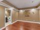 Bonus room with bathroom access featuring hardwood floors, modern trim and Georgia Tech logo on the wall at 1258 Mcallistar Dr, Locust Grove, GA 30248