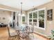Bright breakfast nook featuring a glass table, wooded views, and easy access to outdoor space at 1258 Mcallistar Dr, Locust Grove, GA 30248