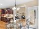 Cozy breakfast nook with a glass-top table and convenient access to the kitchen and outdoor deck at 1258 Mcallistar Dr, Locust Grove, GA 30248