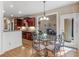 Cozy dining area adjacent to kitchen featuring wood floors and plenty of natural light at 1258 Mcallistar Dr, Locust Grove, GA 30248