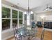 Bright dining area with large windows and a view of the backyard at 1258 Mcallistar Dr, Locust Grove, GA 30248
