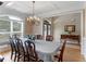 Dining room with hardwood floors, coffered ceilings, and double doors at 1258 Mcallistar Dr, Locust Grove, GA 30248