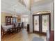 Formal dining room and foyer with hardwood floors, crown molding, and elegant double doors at 1258 Mcallistar Dr, Locust Grove, GA 30248