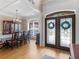Elegant foyer with hardwood floors, ornate double doors, and coffered ceilings at 1258 Mcallistar Dr, Locust Grove, GA 30248