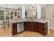Kitchen featuring granite countertops, dark cabinetry, stainless steel dishwasher, and wood floors at 1258 Mcallistar Dr, Locust Grove, GA 30248