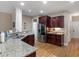 Spacious kitchen features granite countertops, stainless steel appliances, and a breakfast bar at 1258 Mcallistar Dr, Locust Grove, GA 30248