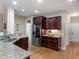 Kitchen features granite countertops, stainless steel appliances, and hardwood floors at 1258 Mcallistar Dr, Locust Grove, GA 30248