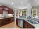 Gourmet kitchen with granite countertops and stainless steel dishwasher at 1258 Mcallistar Dr, Locust Grove, GA 30248
