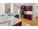 Kitchen featuring granite counters, stainless steel appliances, and dark wood cabinetry at 1258 Mcallistar Dr, Locust Grove, GA 30248