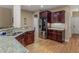 Kitchen featuring granite counters, stainless steel appliances, and dark wood cabinetry at 1258 Mcallistar Dr, Locust Grove, GA 30248