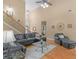 Spacious living room featuring hardwood floors, high ceilings, and a staircase at 1258 Mcallistar Dr, Locust Grove, GA 30248
