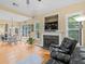 Bright and inviting living room featuring a fireplace, views to the exterior, and comfortable seating at 1258 Mcallistar Dr, Locust Grove, GA 30248