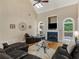 Bright living room with a fireplace, large windows, and comfortable leather seating at 1258 Mcallistar Dr, Locust Grove, GA 30248