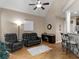 A comfortable living area featuring vaulted ceilings, hardwood floors, and bar seating at 1258 Mcallistar Dr, Locust Grove, GA 30248