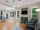 Bright and airy living room with a fireplace, dining area, and large windows at 1258 Mcallistar Dr, Locust Grove, GA 30248