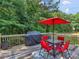Outdoor patio area featuring a table, chairs, and a covered grill, great for entertaining at 1258 Mcallistar Dr, Locust Grove, GA 30248