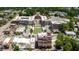 Wide aerial view of a vibrant town center with diverse buildings, green spaces, and active streets at 364 Concord St, Alpharetta, GA 30009