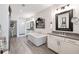 Bright bathroom with free-standing tub, double vanity, walk-in shower, and wood-look tile floors at 364 Concord St, Alpharetta, GA 30009
