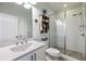 Well-lit bathroom with glass shower, white vanity, and modern fixtures at 364 Concord St, Alpharetta, GA 30009