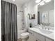 A full bath featuring a shower over tub, white tiled walls, and brushed chrome fixtures at 364 Concord St, Alpharetta, GA 30009