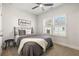 Cozy bedroom with neutral decor, ceiling fan, and plantation shutters for natural light at 364 Concord St, Alpharetta, GA 30009
