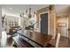 Spacious dining area with large wooden table, bench seating, and elegant chandelier at 364 Concord St, Alpharetta, GA 30009