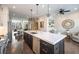 Open concept kitchen features a long island with sink, stainless steel appliances, and modern lighting at 364 Concord St, Alpharetta, GA 30009