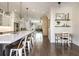 Kitchen with a large island, modern appliances, and an open floor plan flowing into the dining area at 364 Concord St, Alpharetta, GA 30009