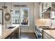 Bright kitchen with stainless steel appliances, a large island, and a view of the backyard at 364 Concord St, Alpharetta, GA 30009