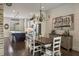 Open kitchen with stainless steel appliances, island seating, and modern lighting at 364 Concord St, Alpharetta, GA 30009