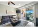 Cozy living room extends to a covered patio with a TV and nice outdoor views at 364 Concord St, Alpharetta, GA 30009