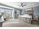 Serene main bedroom with a large bed, multiple windows, and elegant decor at 364 Concord St, Alpharetta, GA 30009