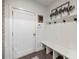 Inviting mudroom with bench, coat hooks, and decorative 'welcome' sign at 364 Concord St, Alpharetta, GA 30009